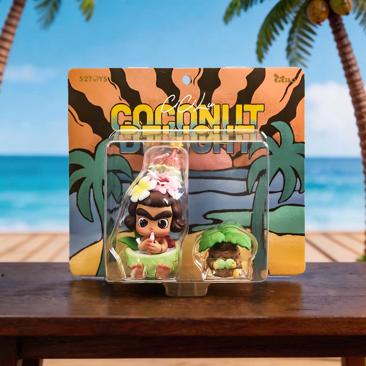 Boxed figure set displayed on a wooden table by the beach, Cicilu Coconut Delight Figure