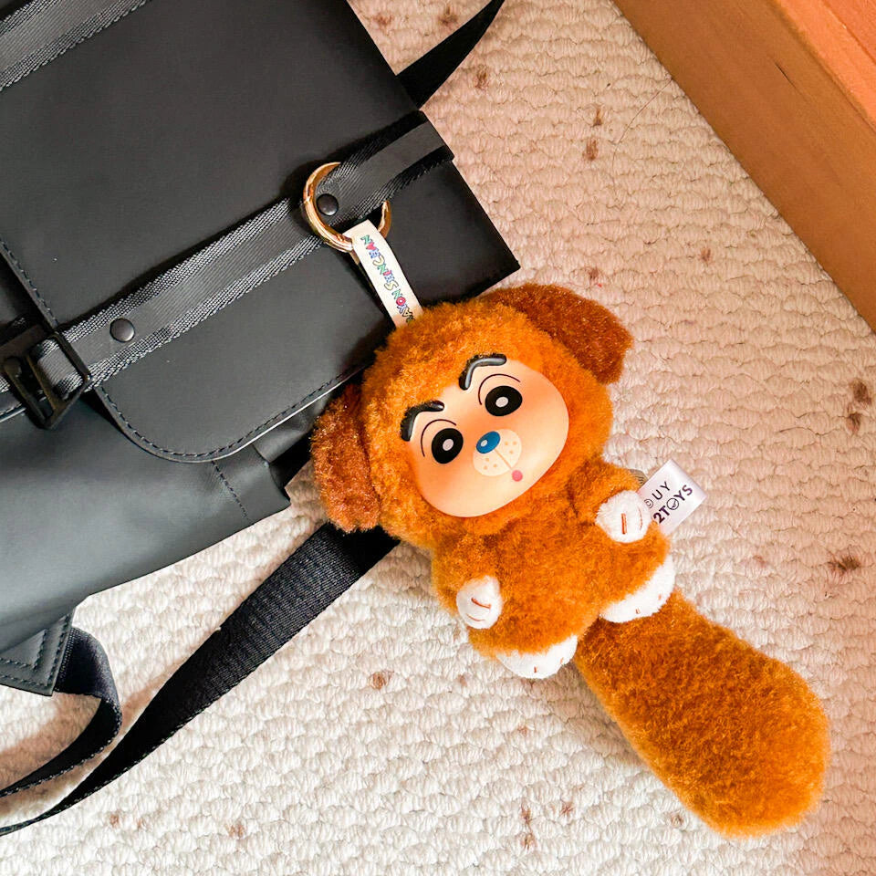 Brown dog-costume Shinchan Big Tails plush keychain attached to a black shoulder bag
