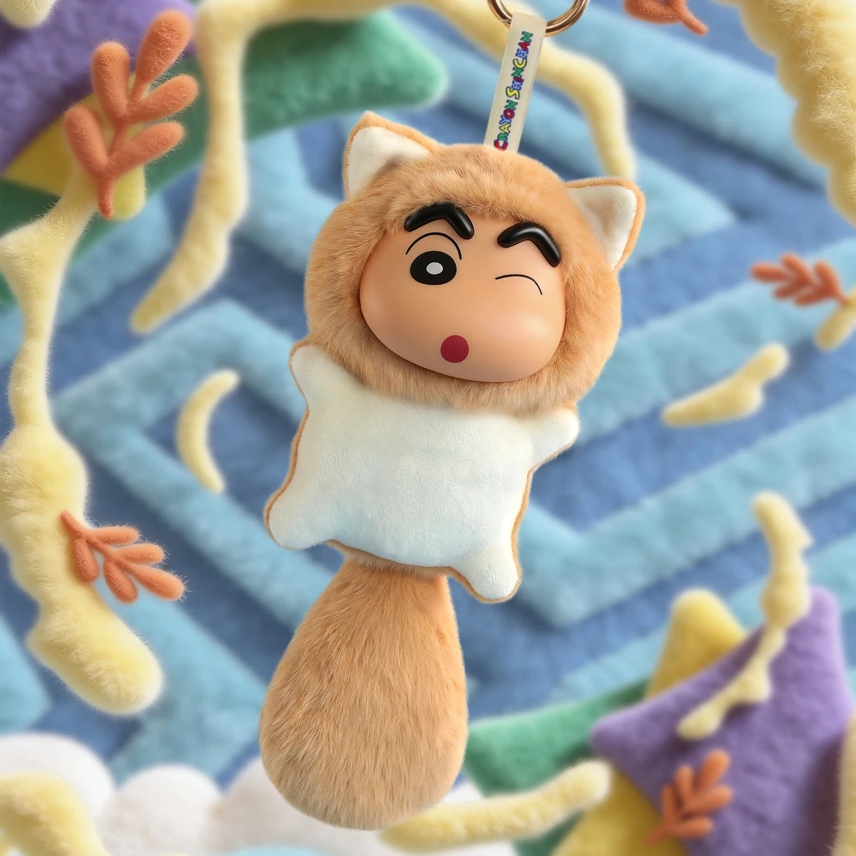 Squeaky Cheeks plush keychain, winking Shinchan in a tan kitten hood with fluffy tail, Big Tails Series 2