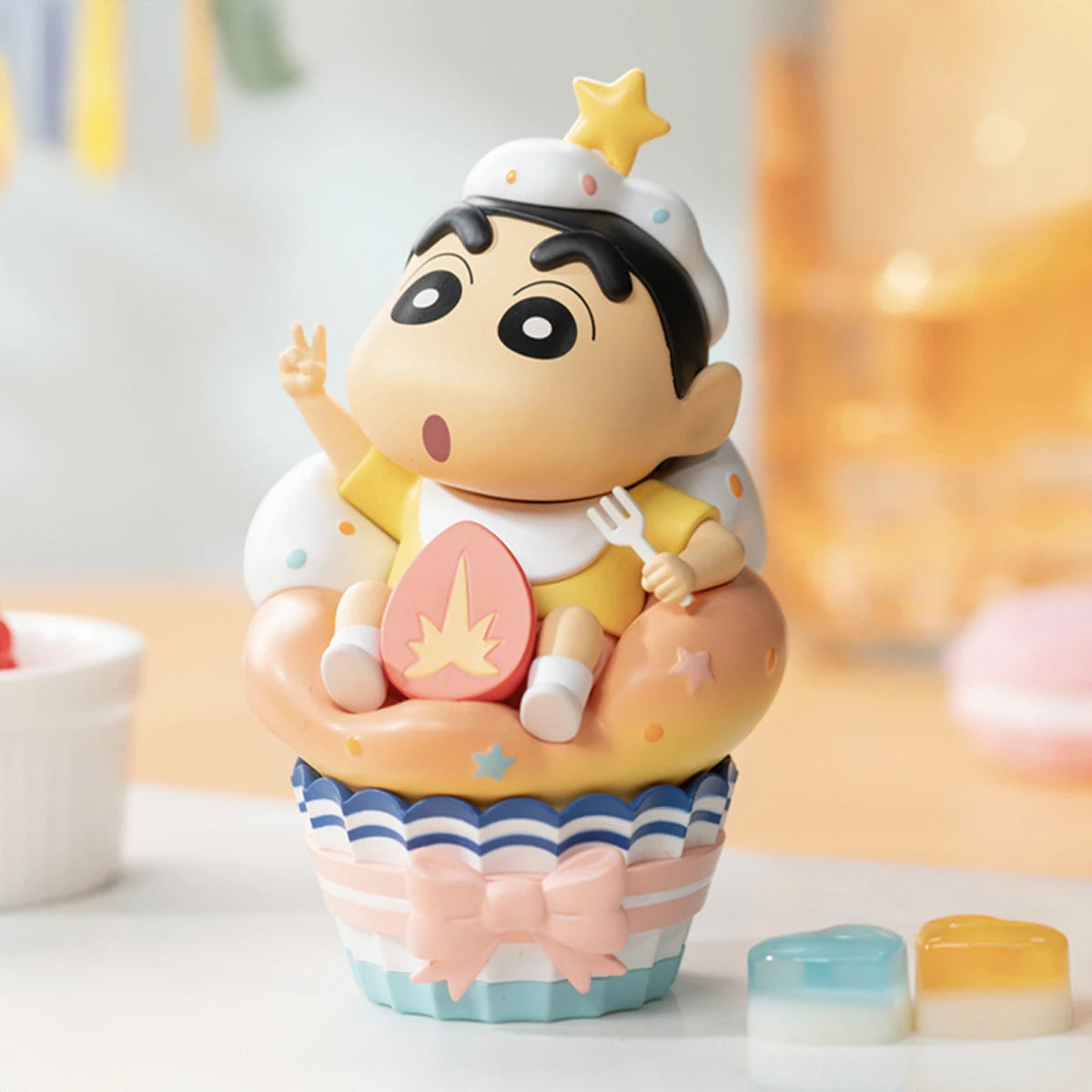 Strawberry cake figurine, Shinchan in a striped cupcake liner with frosting hat and strawberry, Dessert Time
