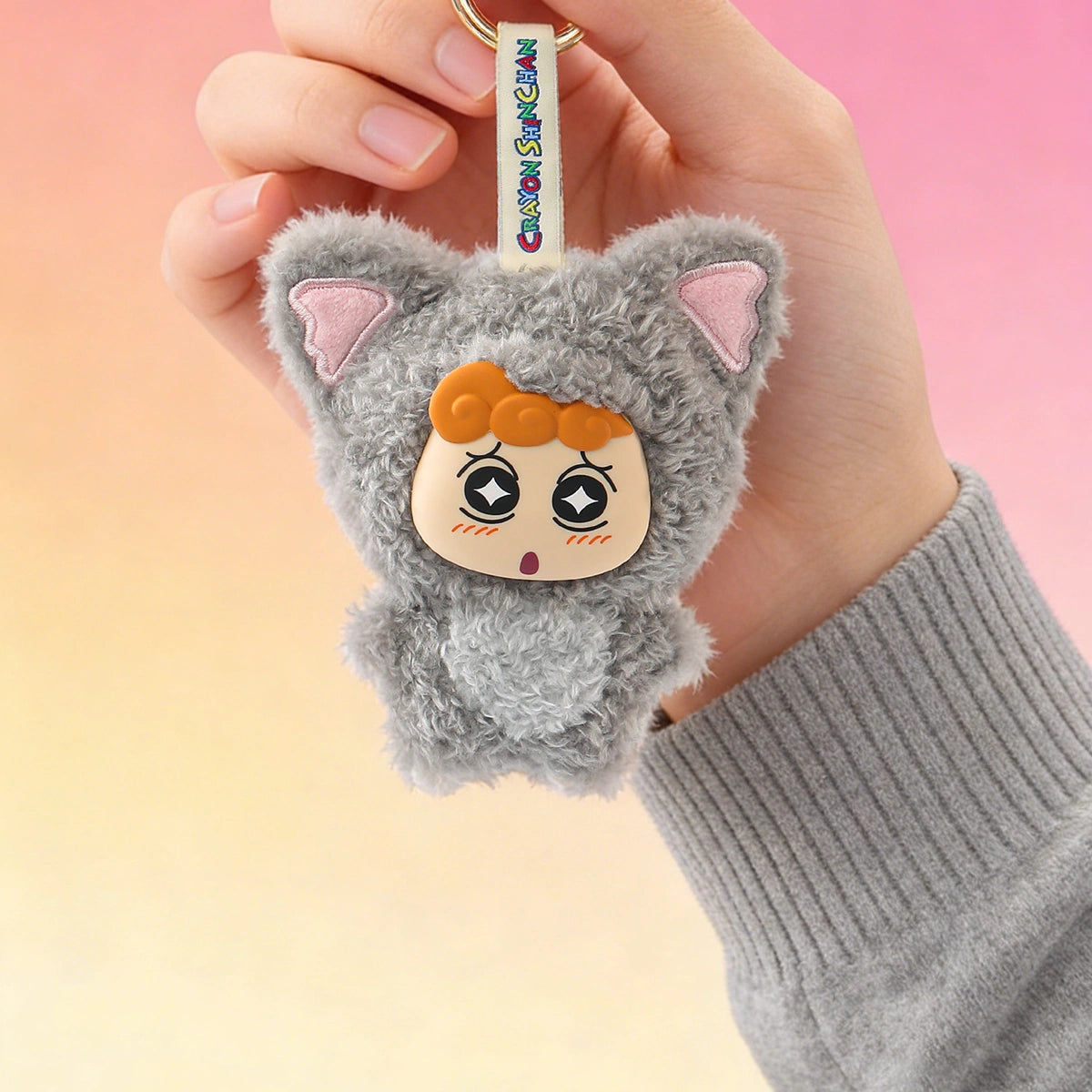 Koala Himawari plush keychain charm in grey koala onesie held in hand, Crayon Shinchan Kasukabe Party