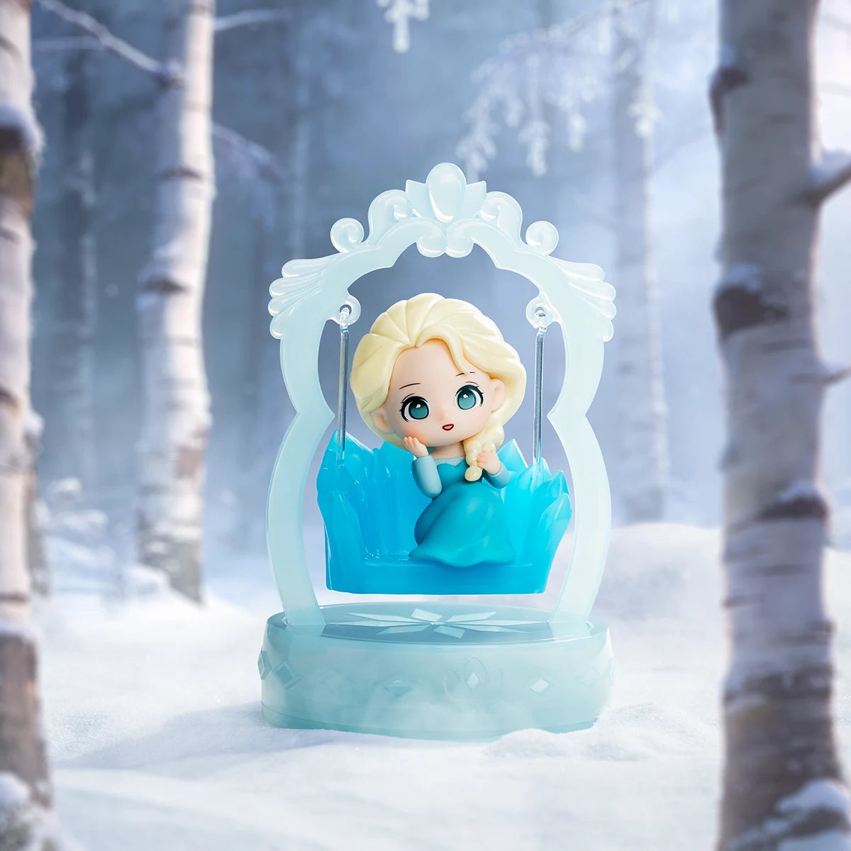 Moments with Elsa: young Elsa in teal dress with a braid on an ice swing, Frozen Enchanted Swing