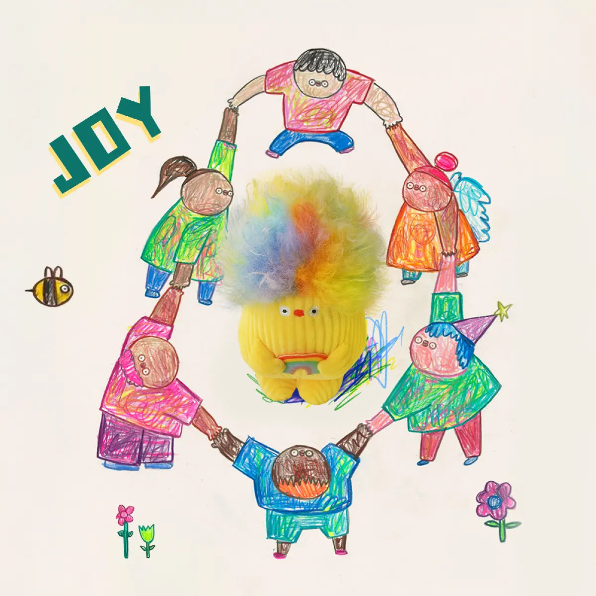 Flabjacks Joy yellow plush with rainbow hair surrounded by a circle of children