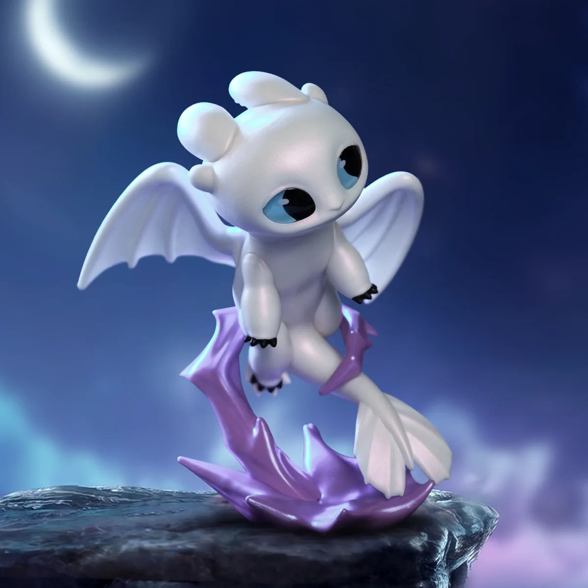 Light Fury figure on a purple crystal base beneath a crescent moon from the Intertwined Light & Night Series by 52TOYS