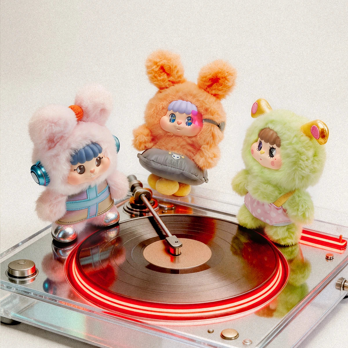 Four Little Buns space fantasy plush characters gathered around a red-lit record player