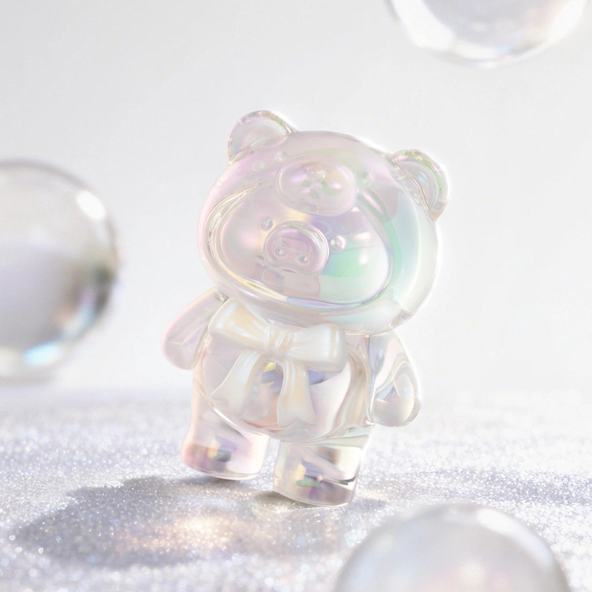 Iridescent clear crystalline Lulu piggy figure sparkling on glitter, Teddy Mini Ore Collection