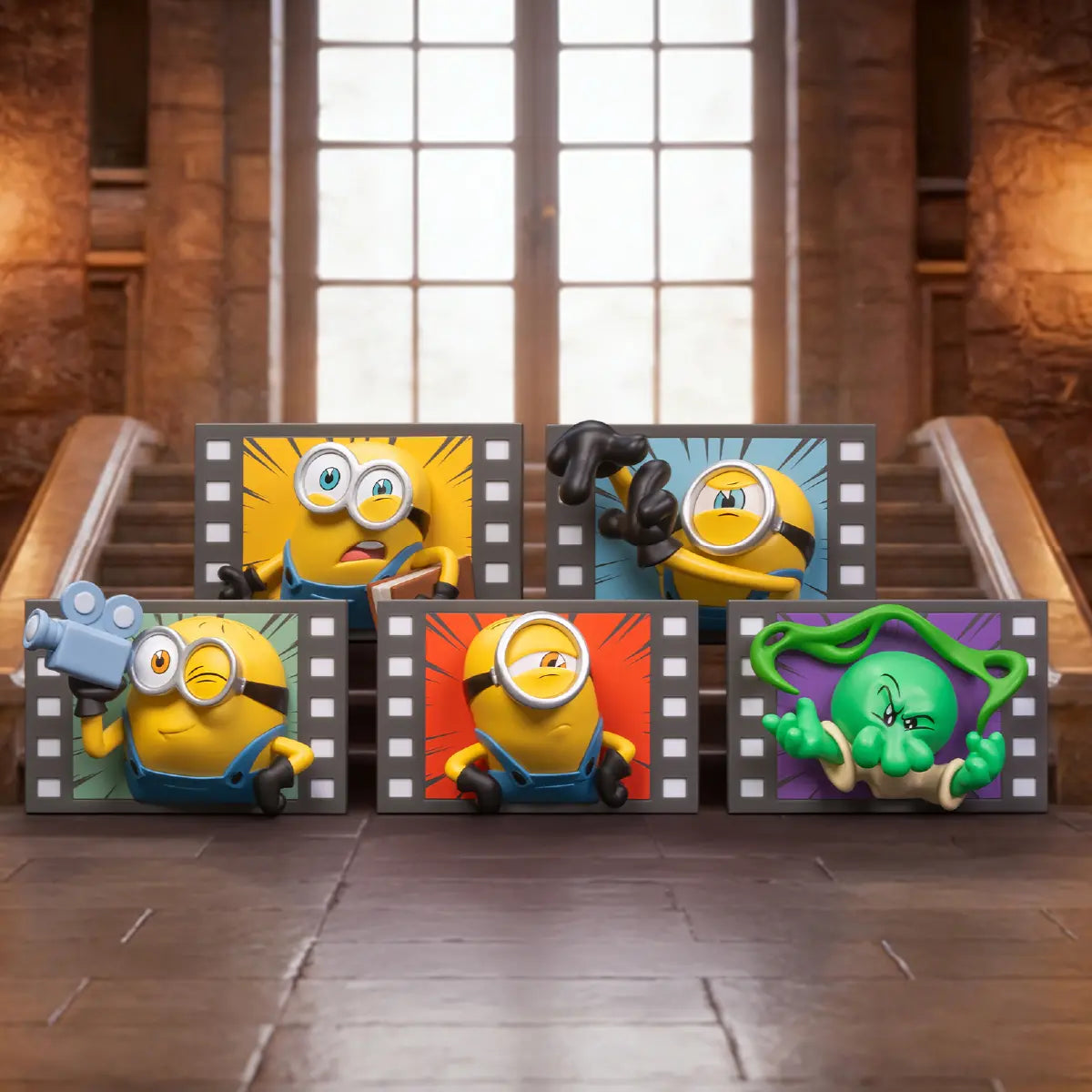 Five Minions & Monsters Action fridge magnets arranged on a miniature film set