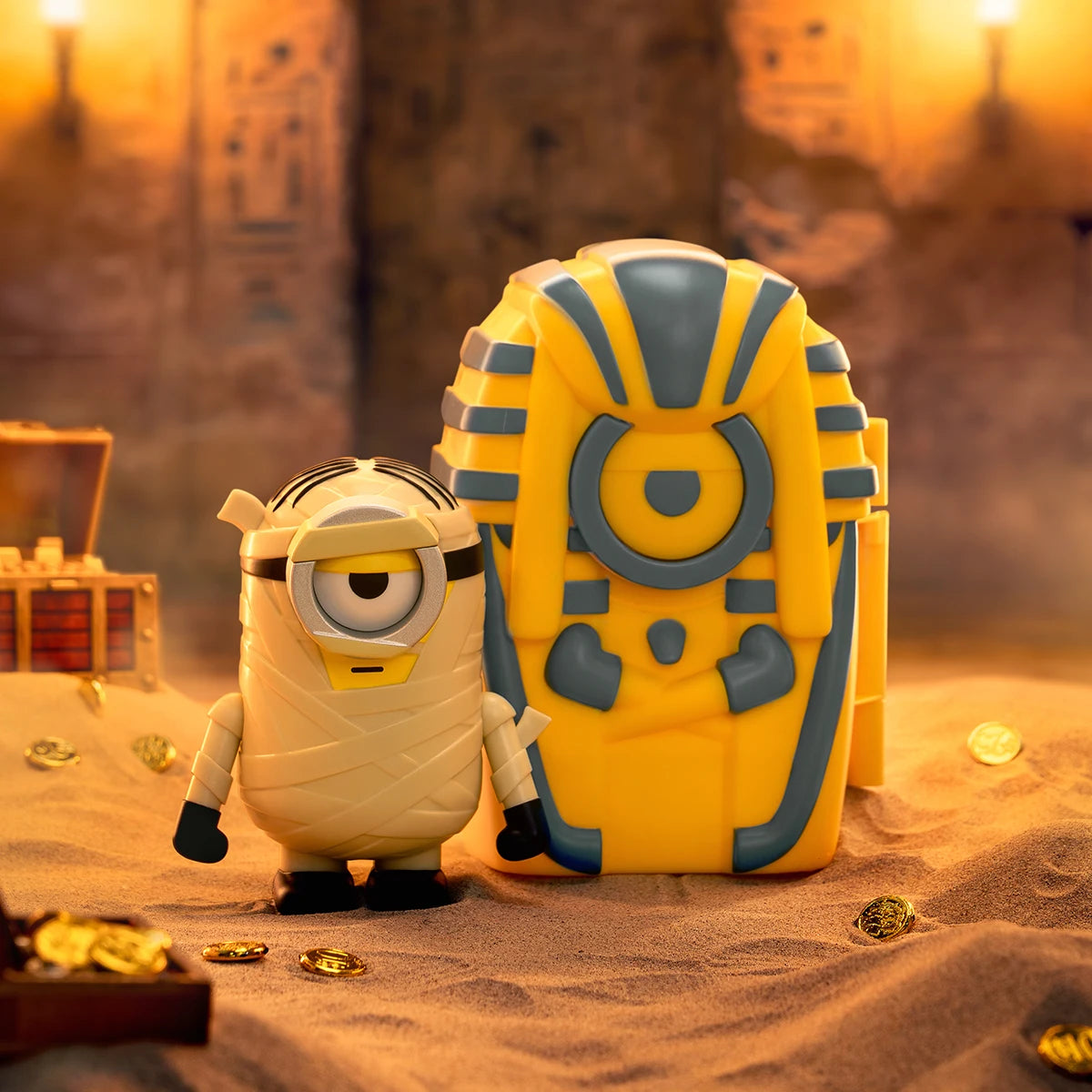 The Mummy Stuart, a bandaged one-eyed Minion beside its pharaoh sarcophagus in a tomb, Minion Monsters