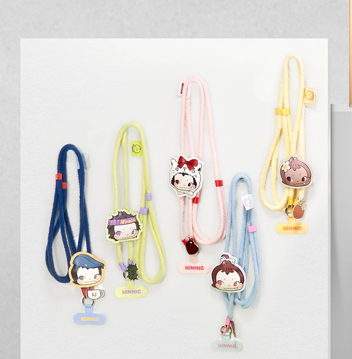 Five NINNIC Wild & Free cartoon-charm phone strap lanyards displayed together, blind box series