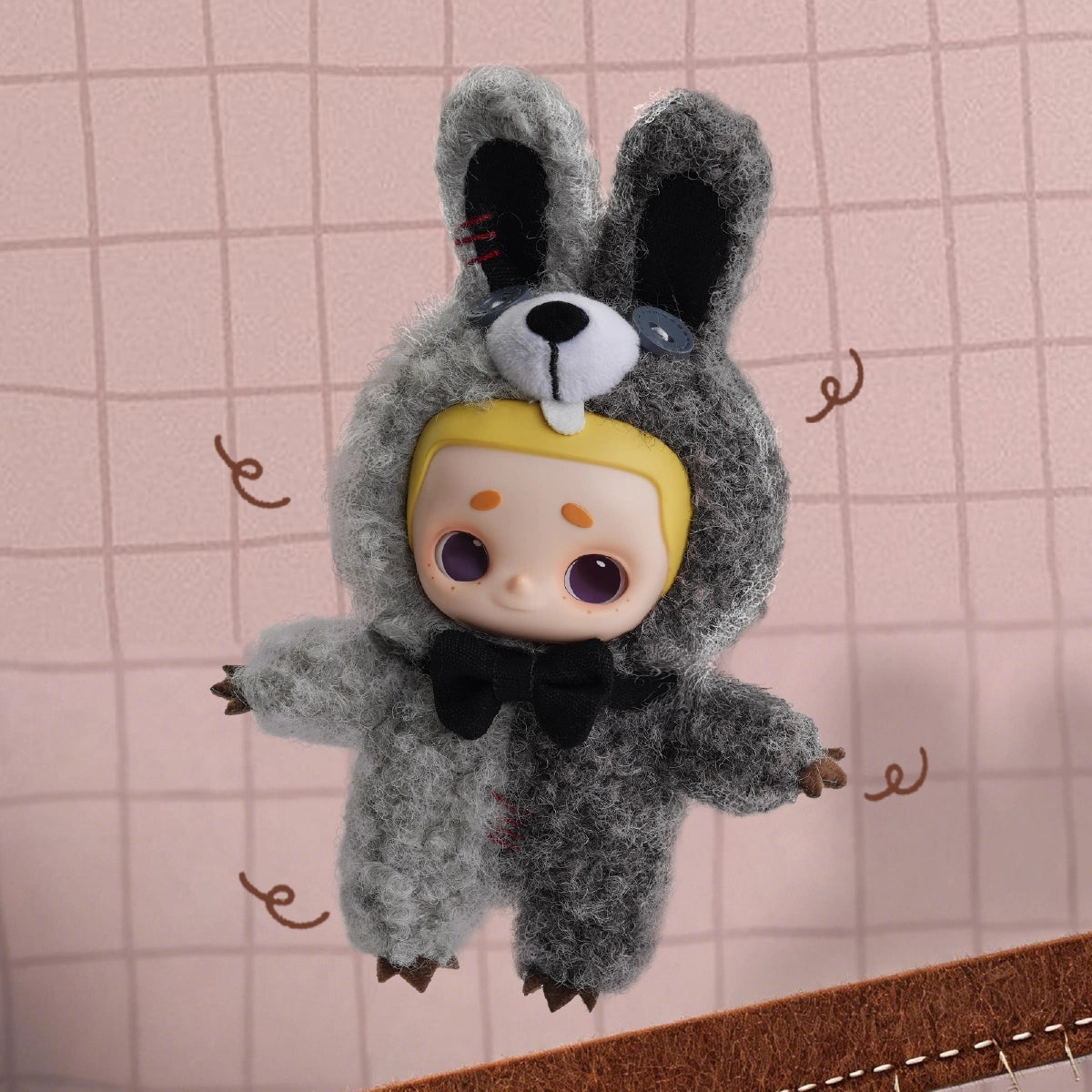NOOK plush in a gray rabbit costume with black bow tie