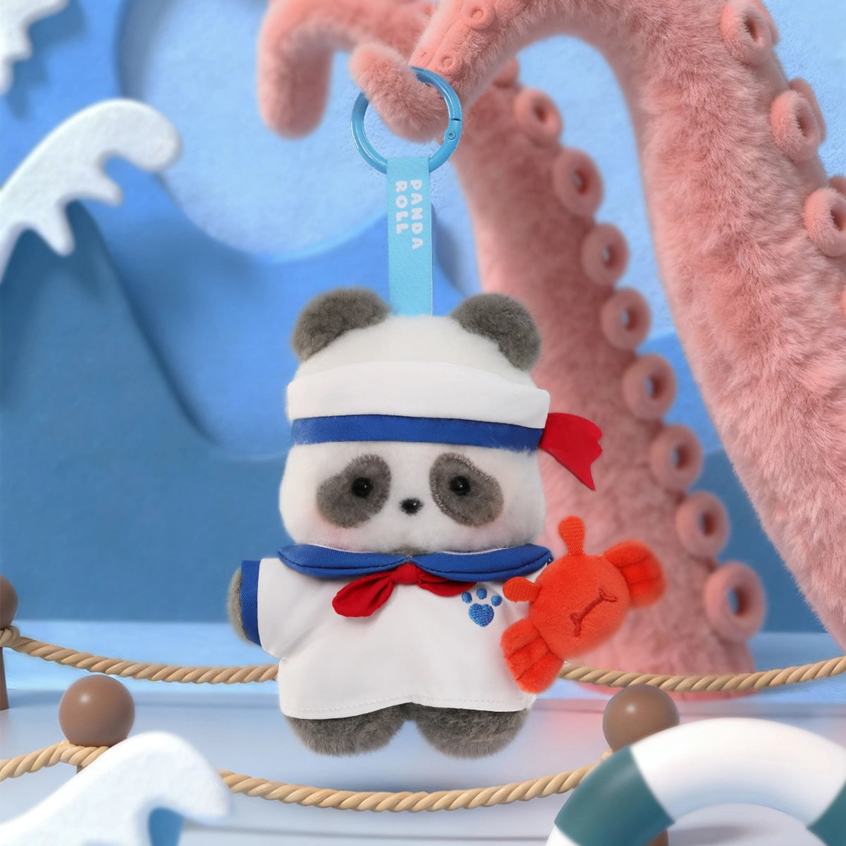 Panda Sailor plush charm in white sailor outfit with red scarf beside a little red crab, Panda Roll Happy Weekend
