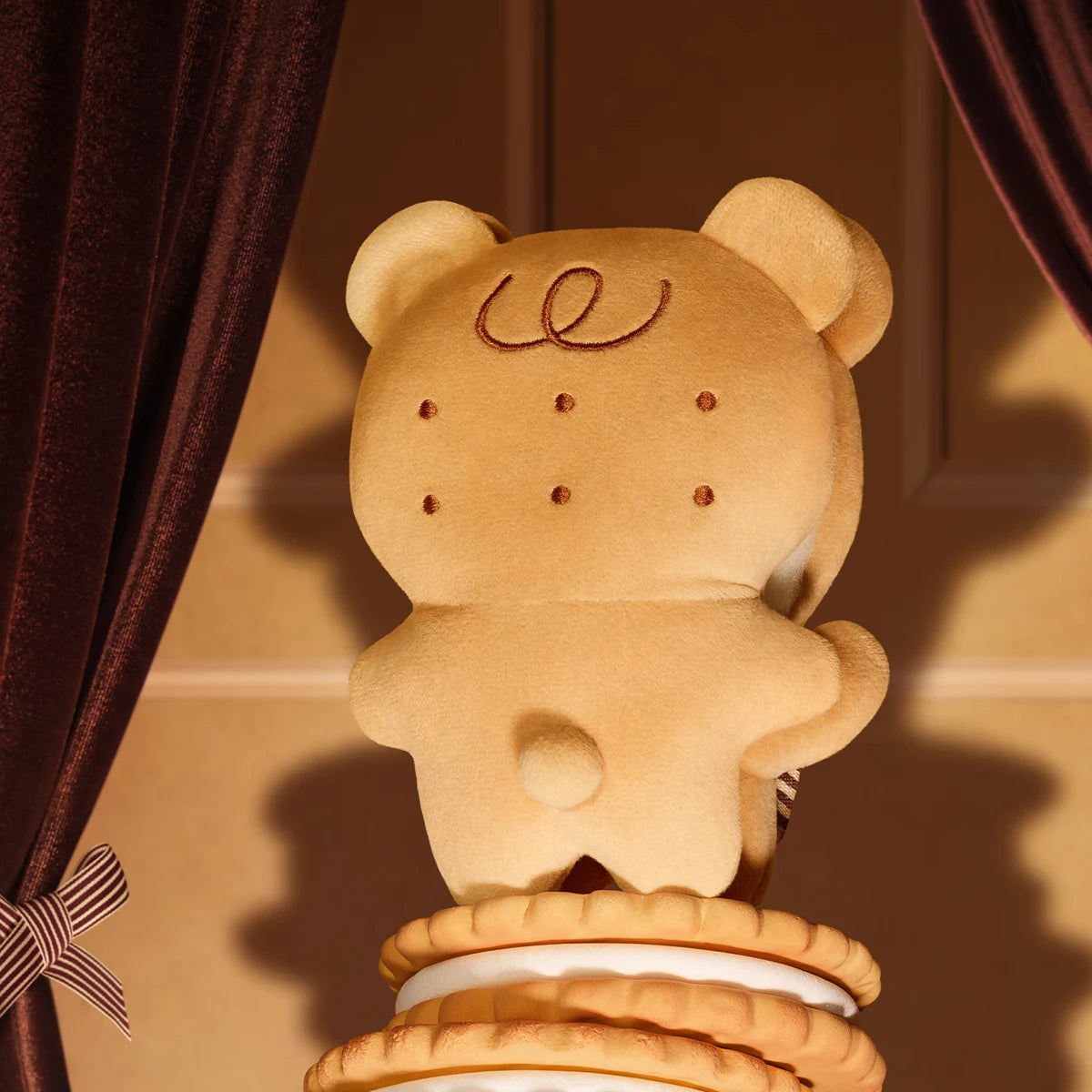 Back of Bear Cookie biscuit-themed plush showing curl embroidery and paw tail, POUKAPOUKA Me & I