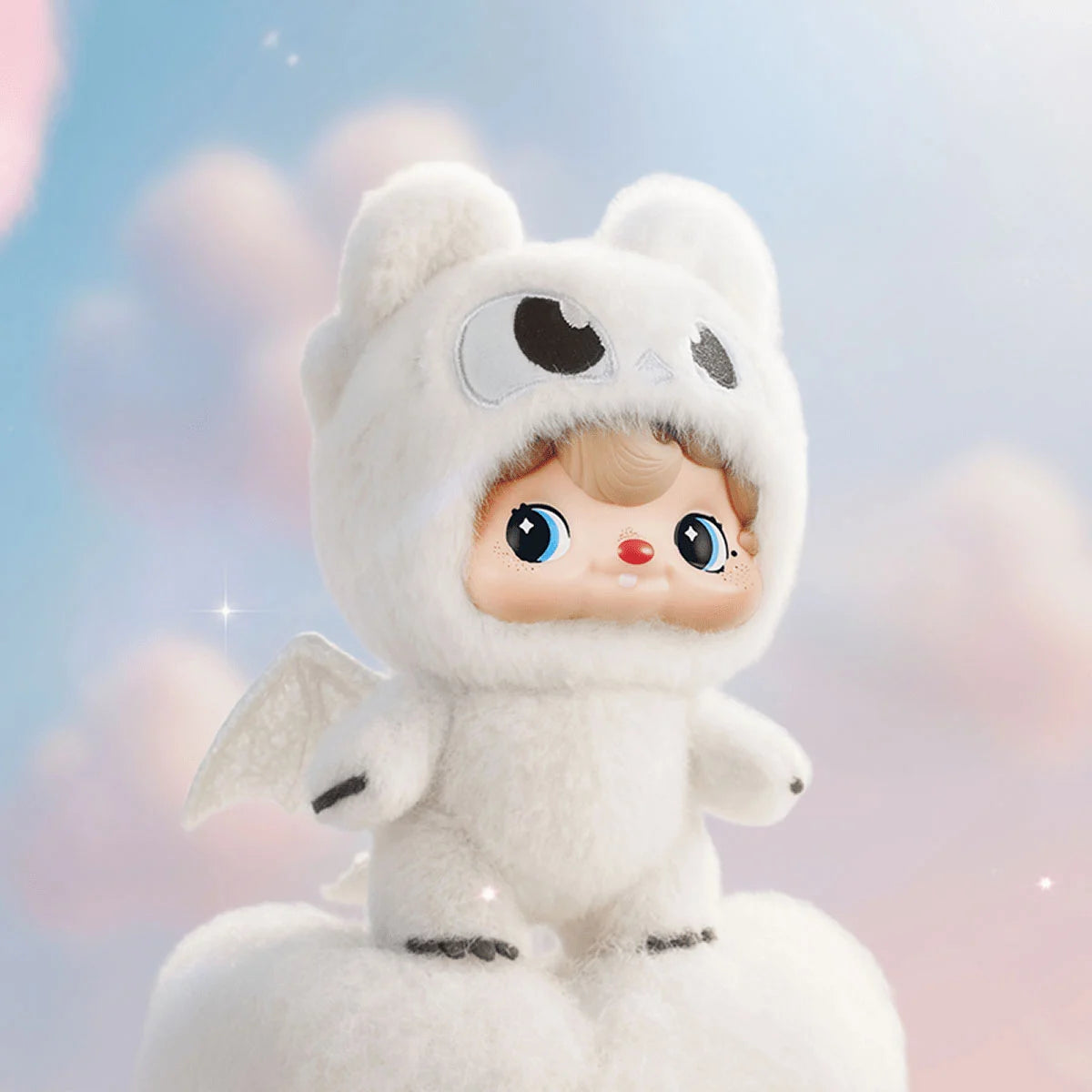 Light Fury POUKA doll in white dragon onesie with shimmering wings perched on a cloud