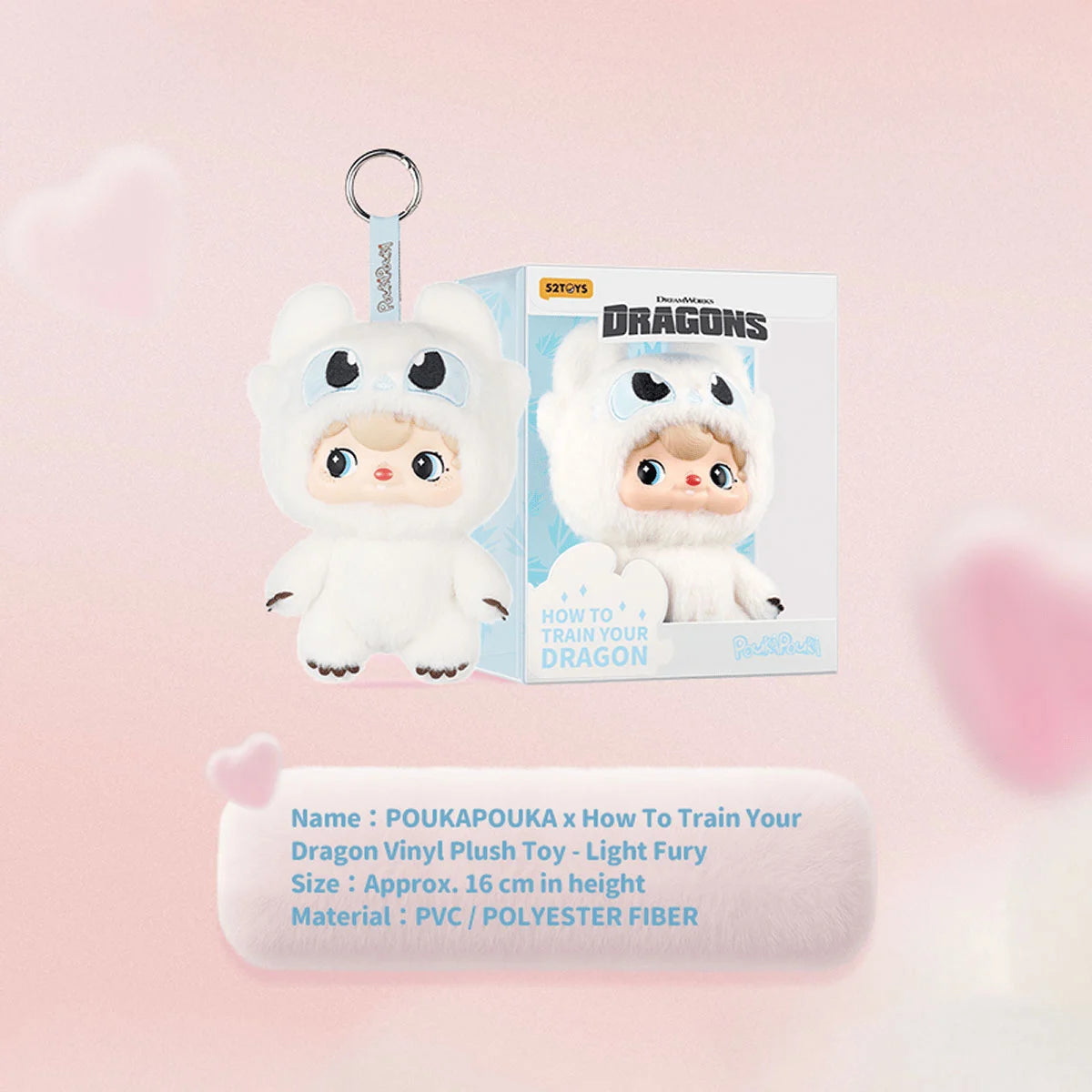 Light Fury POUKA plush keychain beside its DreamWorks Dragons box, approx 16cm