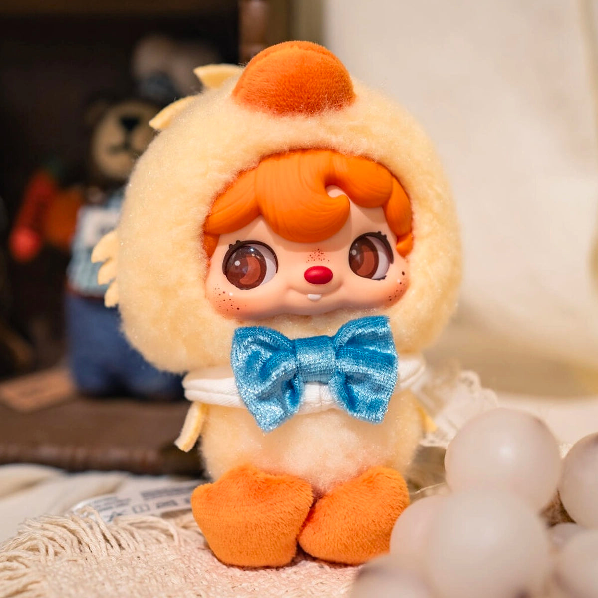 Close view of POUKAPOUKA in a fluffy Quacker duck costume with blue bow tie