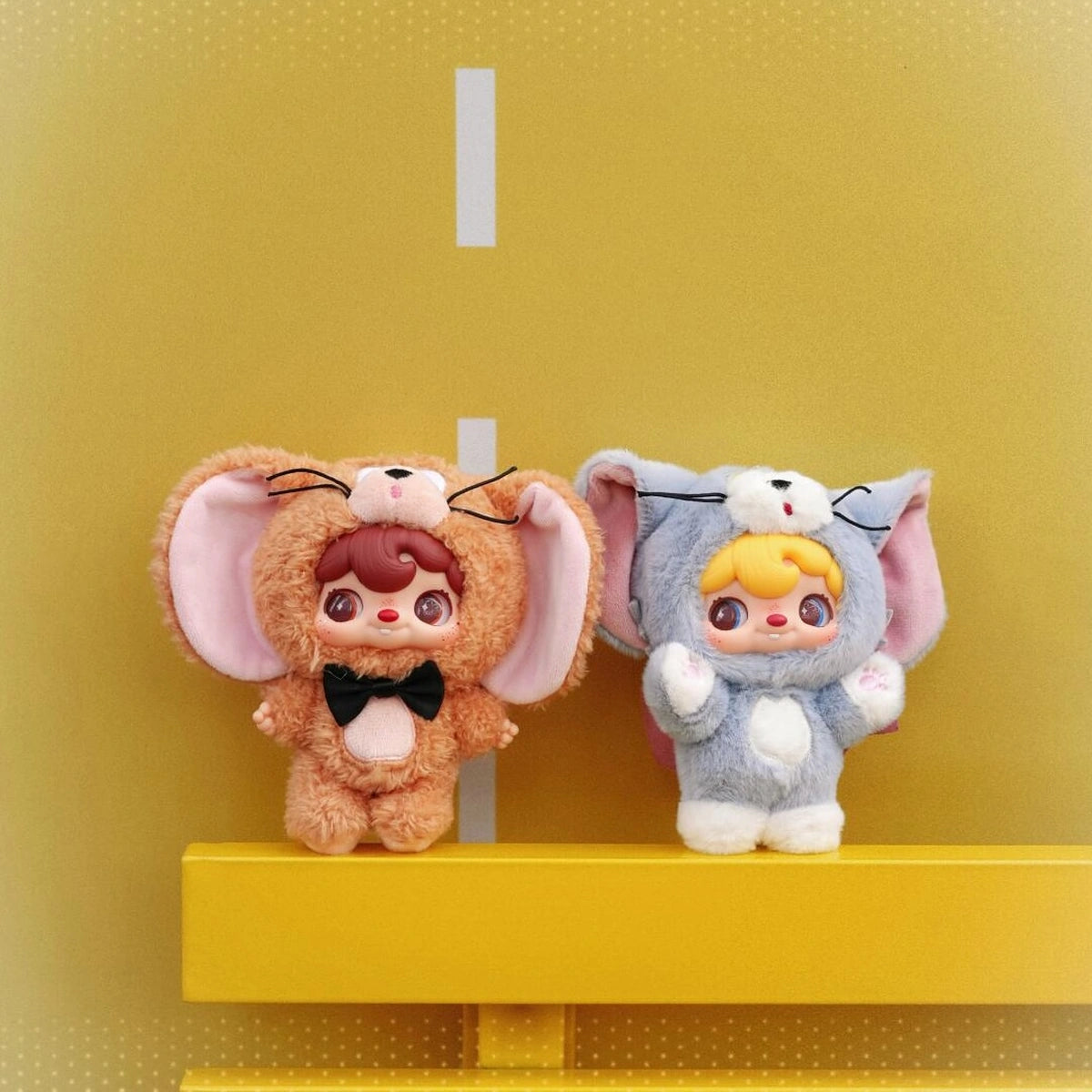 POUKAPOUKA brown Jerry and gray Tom costume plush toys on a yellow shelf