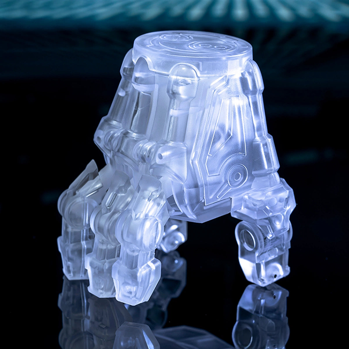 Translucent mechanical Quesera Stranger Hand figure displayed on a dark blue surface