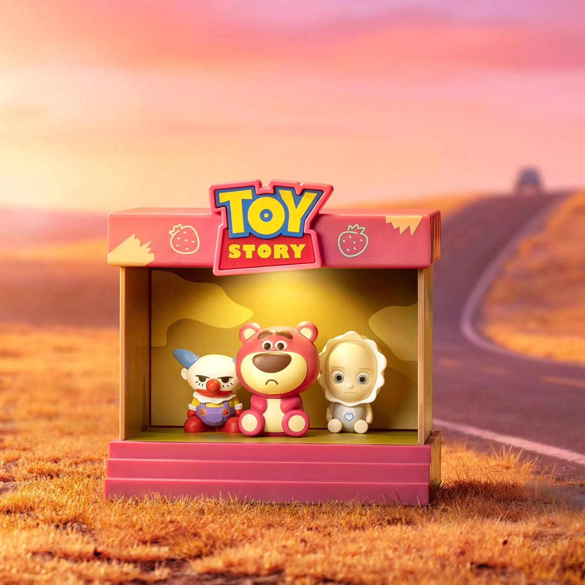 Chuckles, Lotso, and Big Baby together inside a sunset stage frame