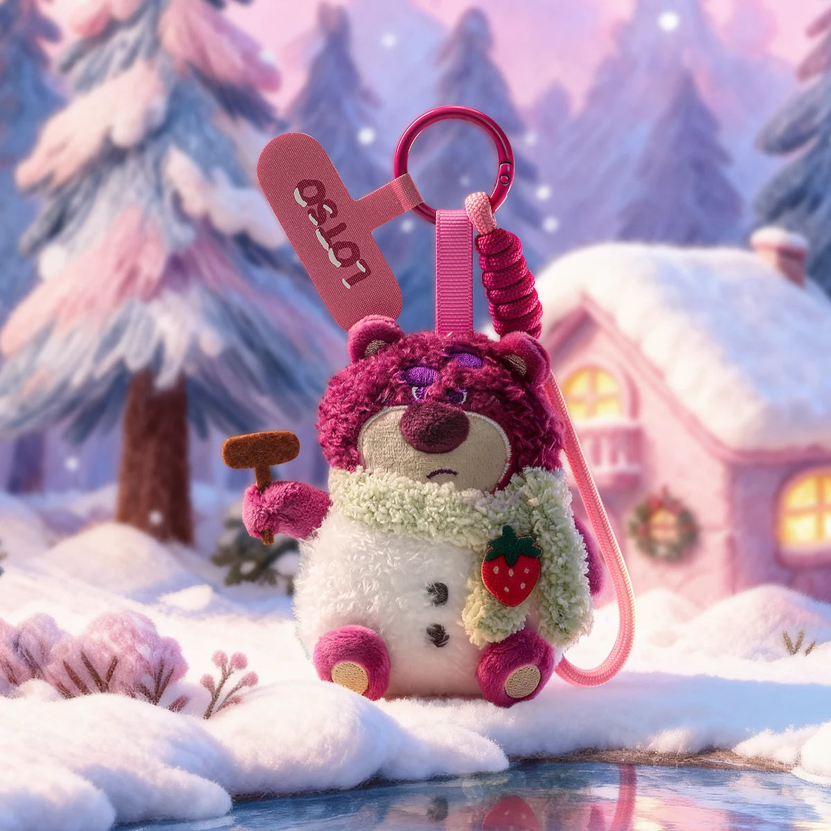 Lotso plush phone charm in a snowman costume posed in a snowy village