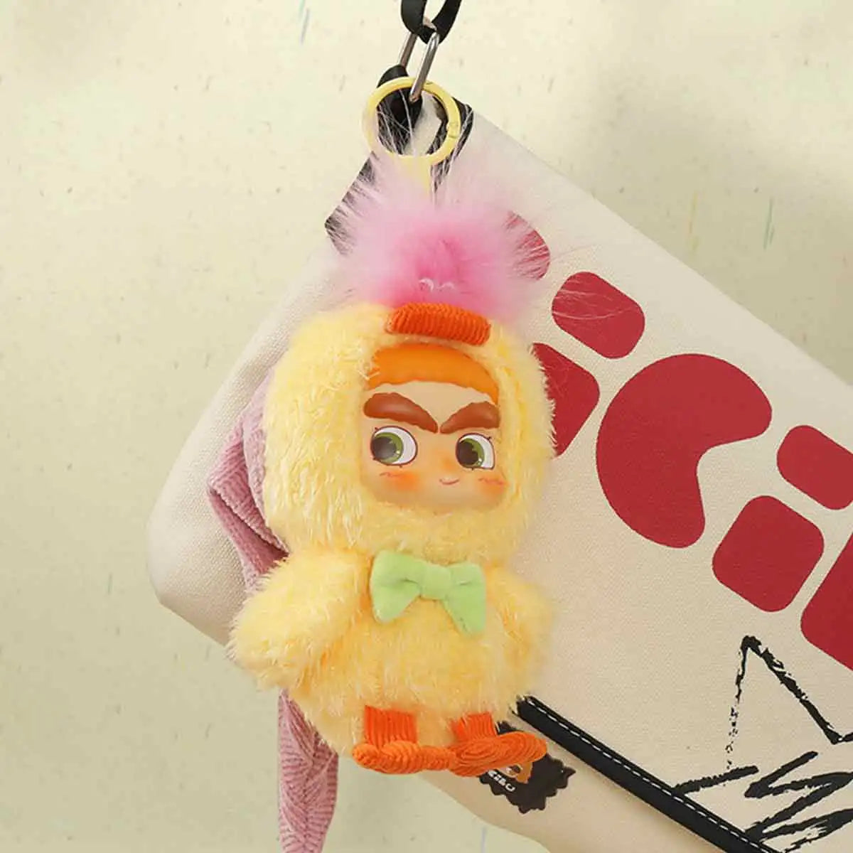 CICILU Huggy Ducky plush keychain in yellow duck costume hanging from a bag strap by its key ring