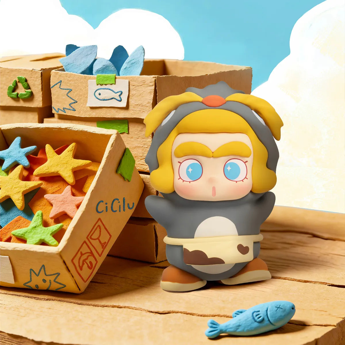 Peppy Penguin staff in grey suit with yellow crest holding a blue fish, CiCiLu The Tide Shop blind box