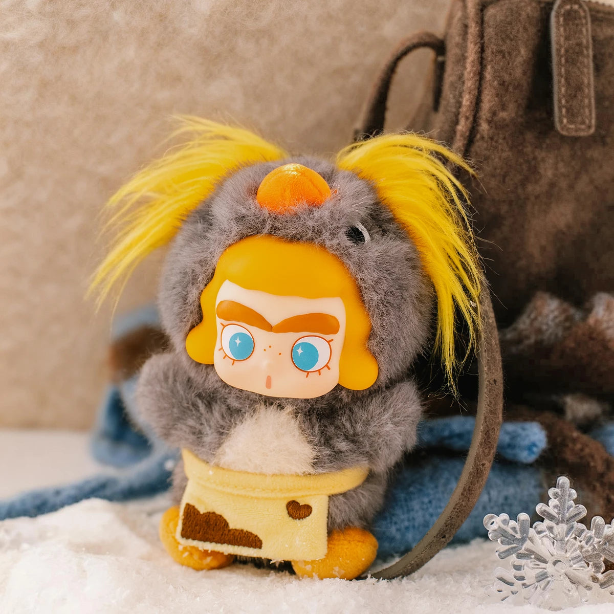 Gosling plush hanging-card charm leaning against a backpack in winter, CiCiLu The Tide Shop