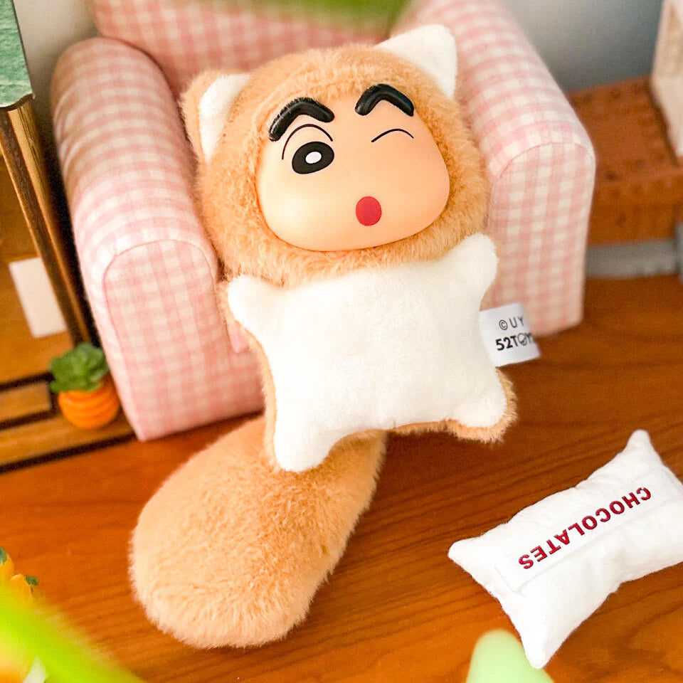 Shinchan Big Tails cat-costume plush reclining in a miniature pink armchair