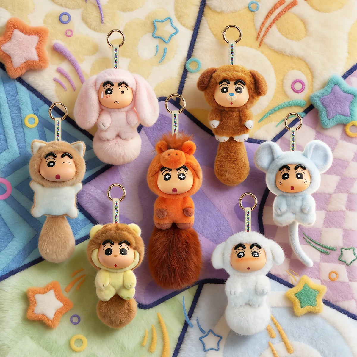 Full set of Crayon Shinchan Big Tails Series 2 plush keychains on a starry blanket