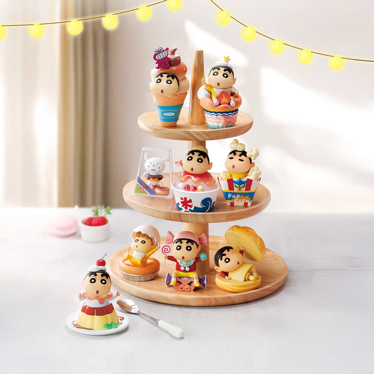 Full lineup of Crayon Shinchan Dessert Time figures posed in sweets on a tiered stand, blind box