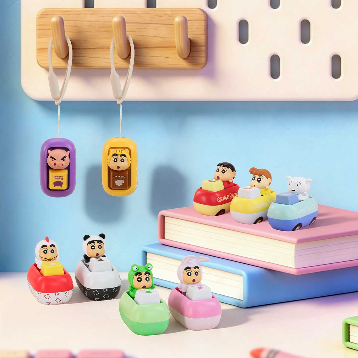 Crayon Shinchan keycap car figures and BuriBuriZaemon charms displayed on a desk pegboard, Tap & Relieve Series