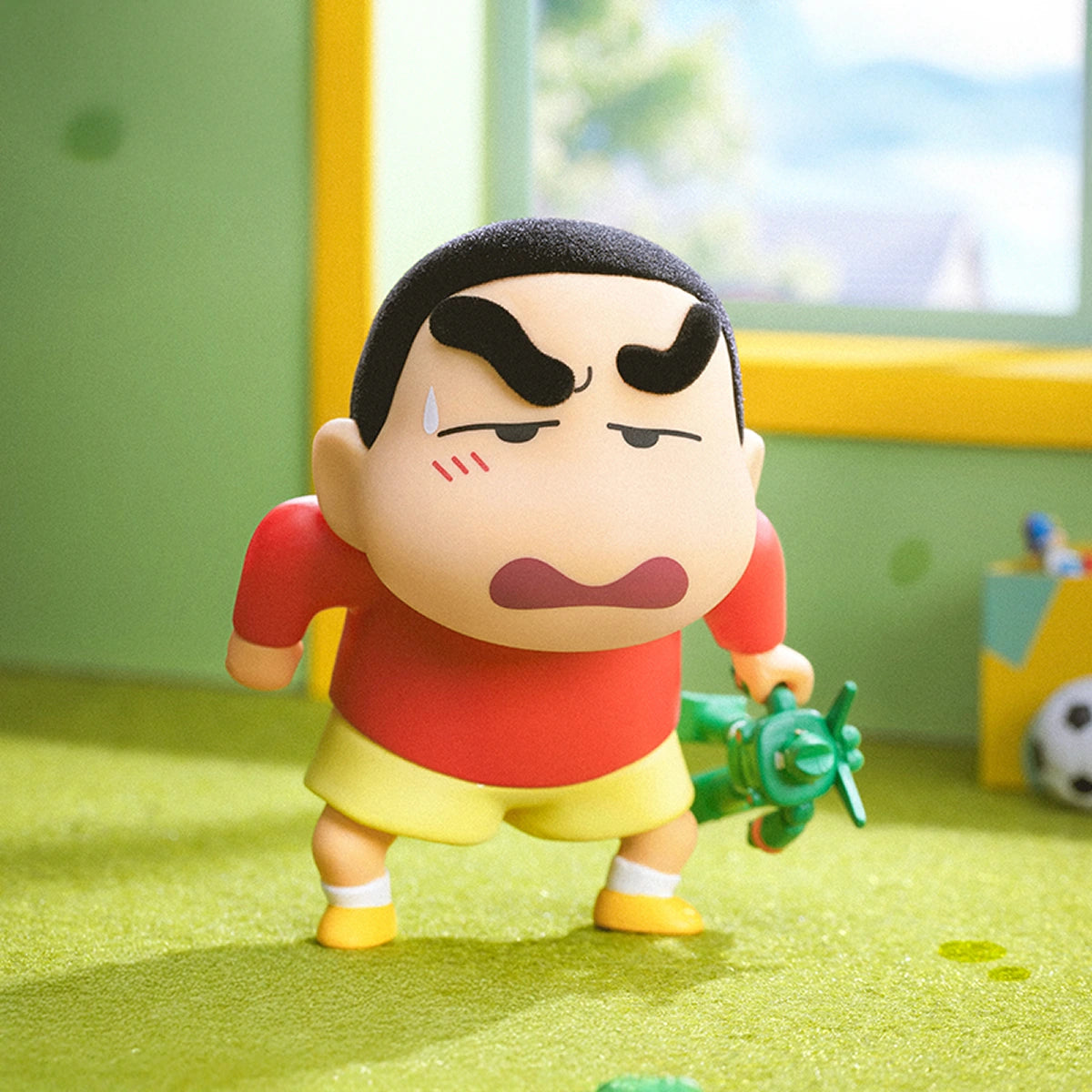 Angry Potato Head Shinchan with furious brows holding a green toy plane, Early Potato Head
