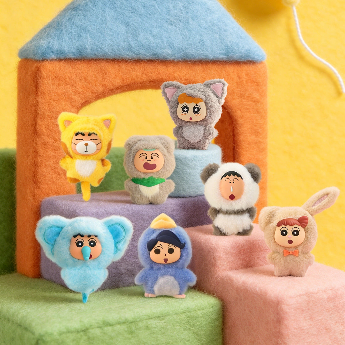 Seven Kasukabe Party plush charms in cat, koala, panda and rabbit onesies on cozy steps, Crayon Shinchan