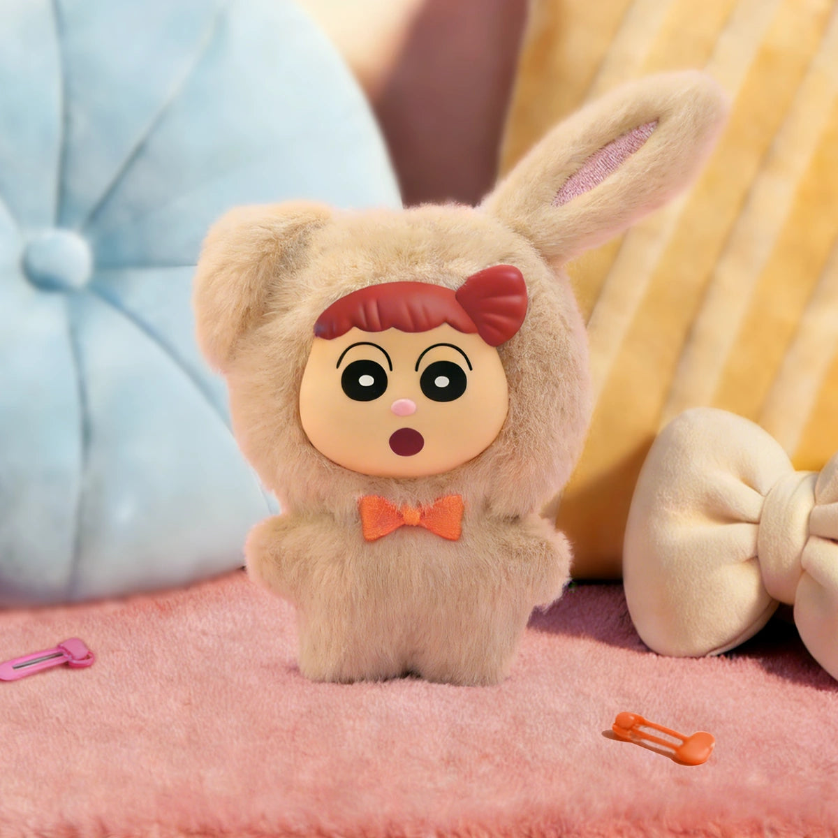 Rabbit Nenechan plush charm in tan bunny onesie with orange bow on a pink cushion, Crayon Shinchan Kasukabe Party
