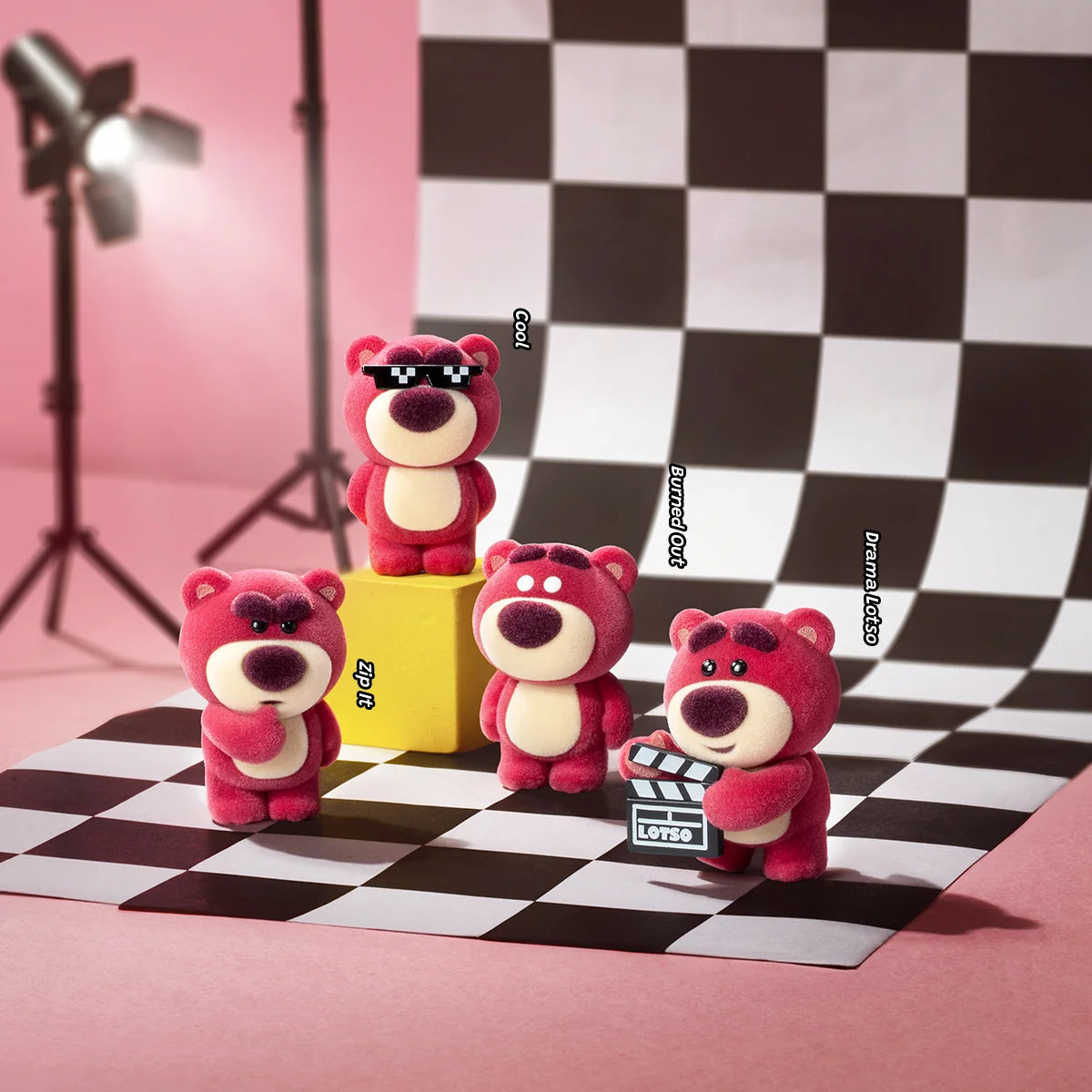Five Lotso MiniMe figures with sunglasses, clapperboard, and expressive poses on a checkerboard set