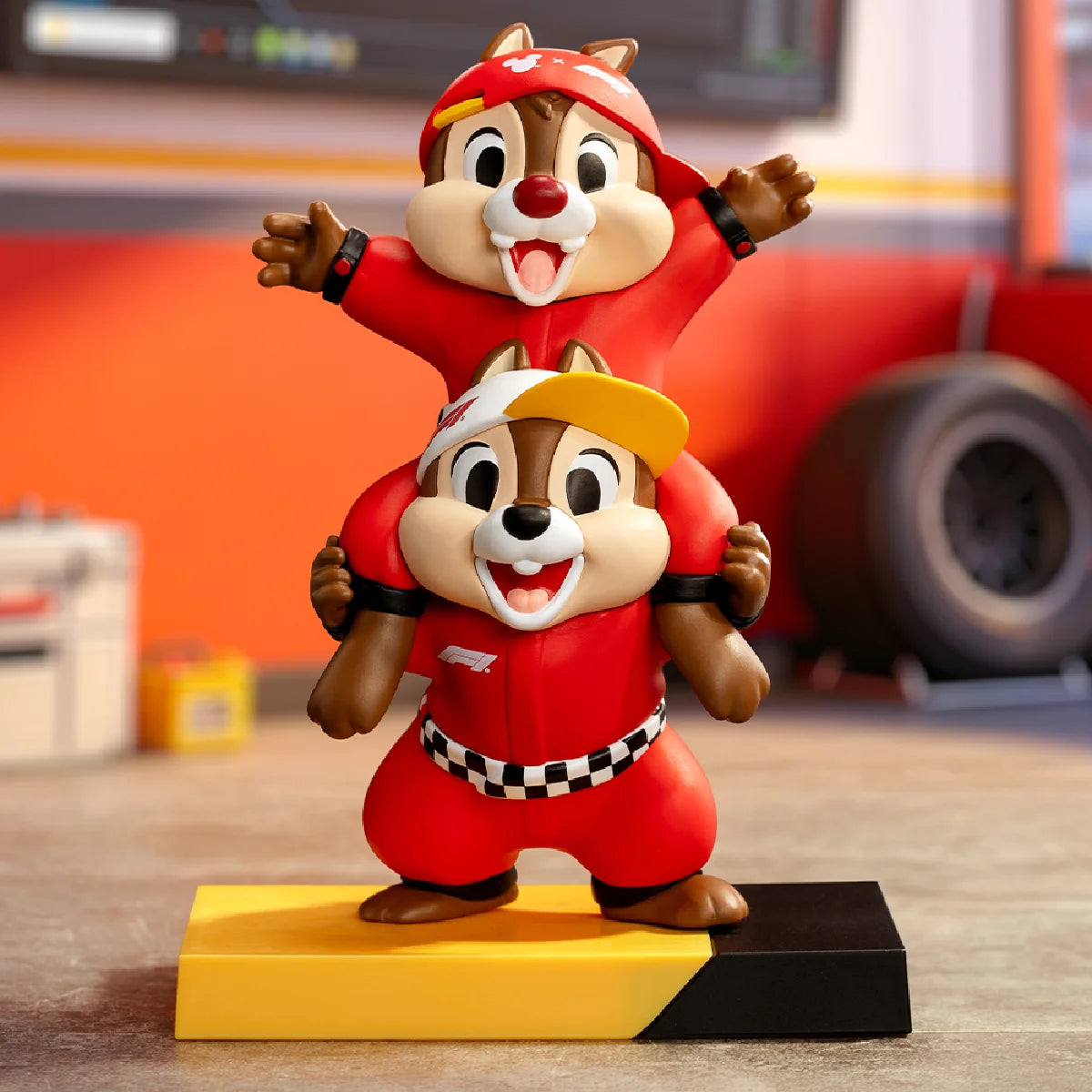 Chip riding on Dale's shoulders in red F1 team uniforms