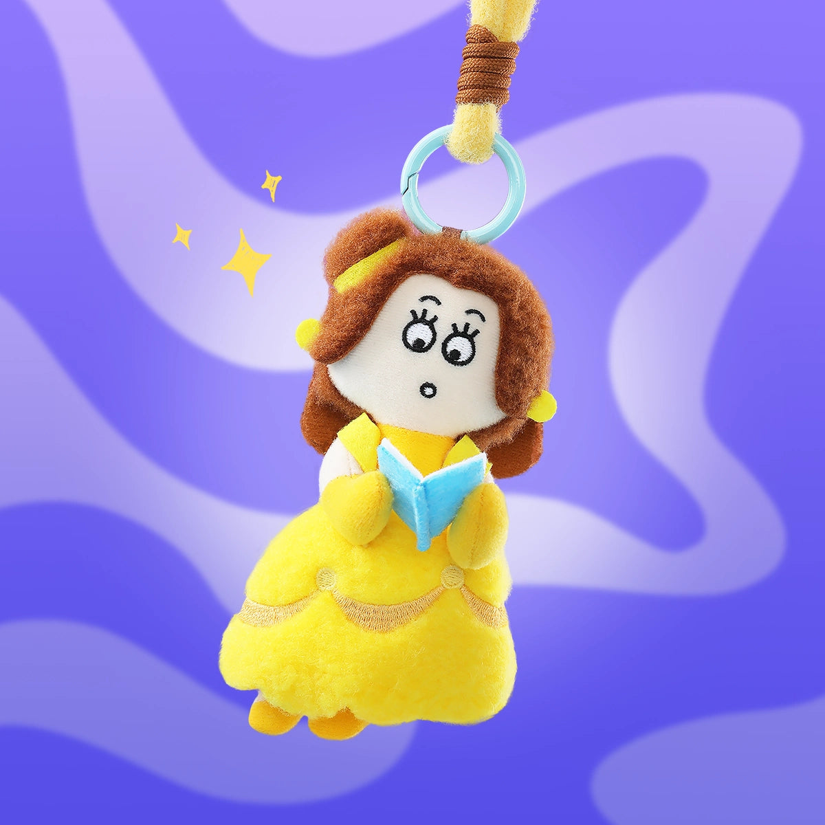 Disney Princess On The Run plush keychains styled with a blue handbag in a playful lifestyle scene