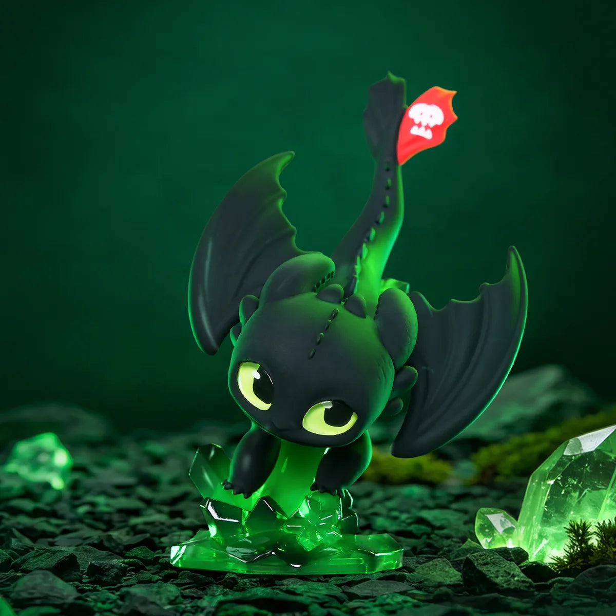 Toothless figure on a glowing green crystal forest base from the Intertwined Light & Night Series by 52TOYS