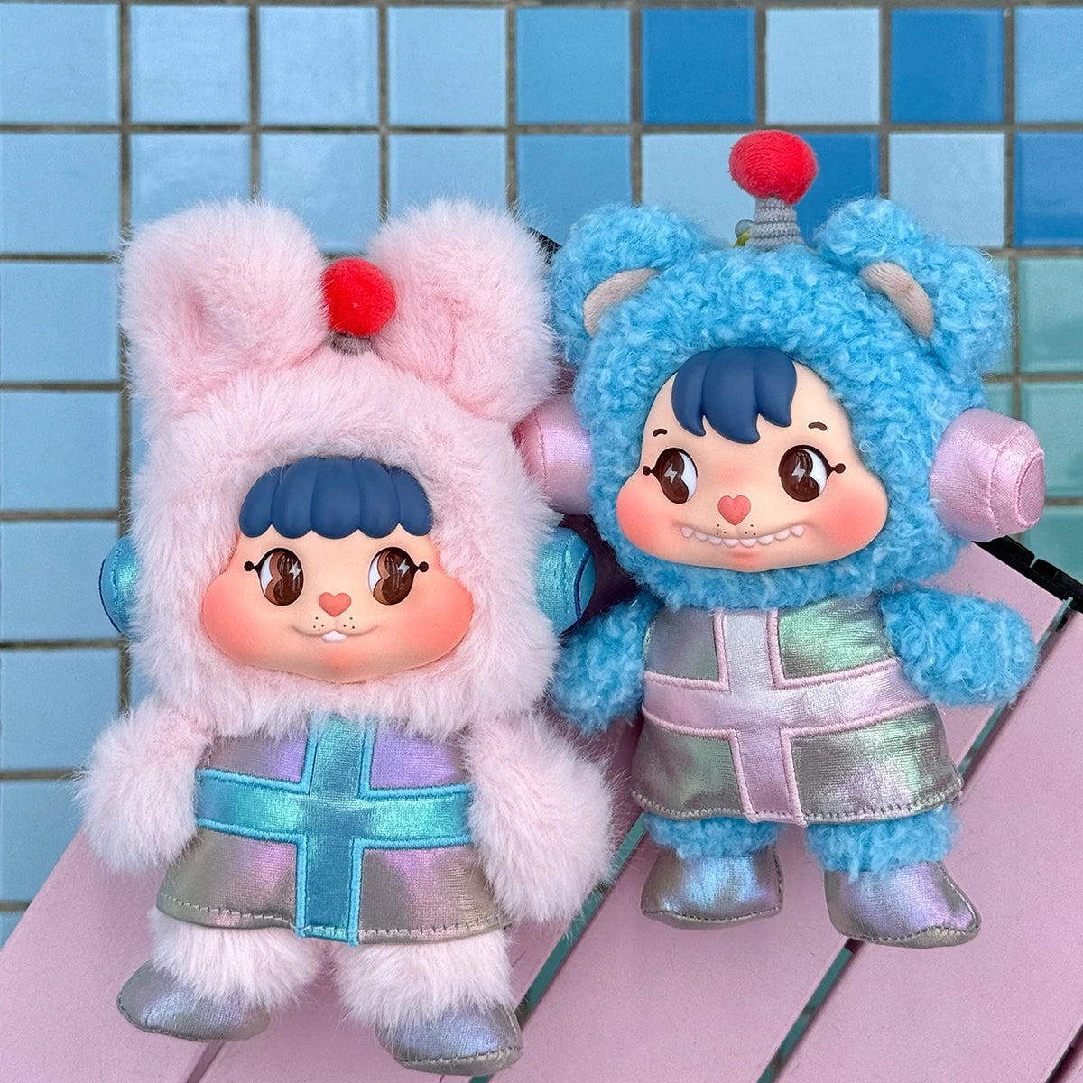 Little Buns pink rabbit and blue bear space-suit plush characters posing together