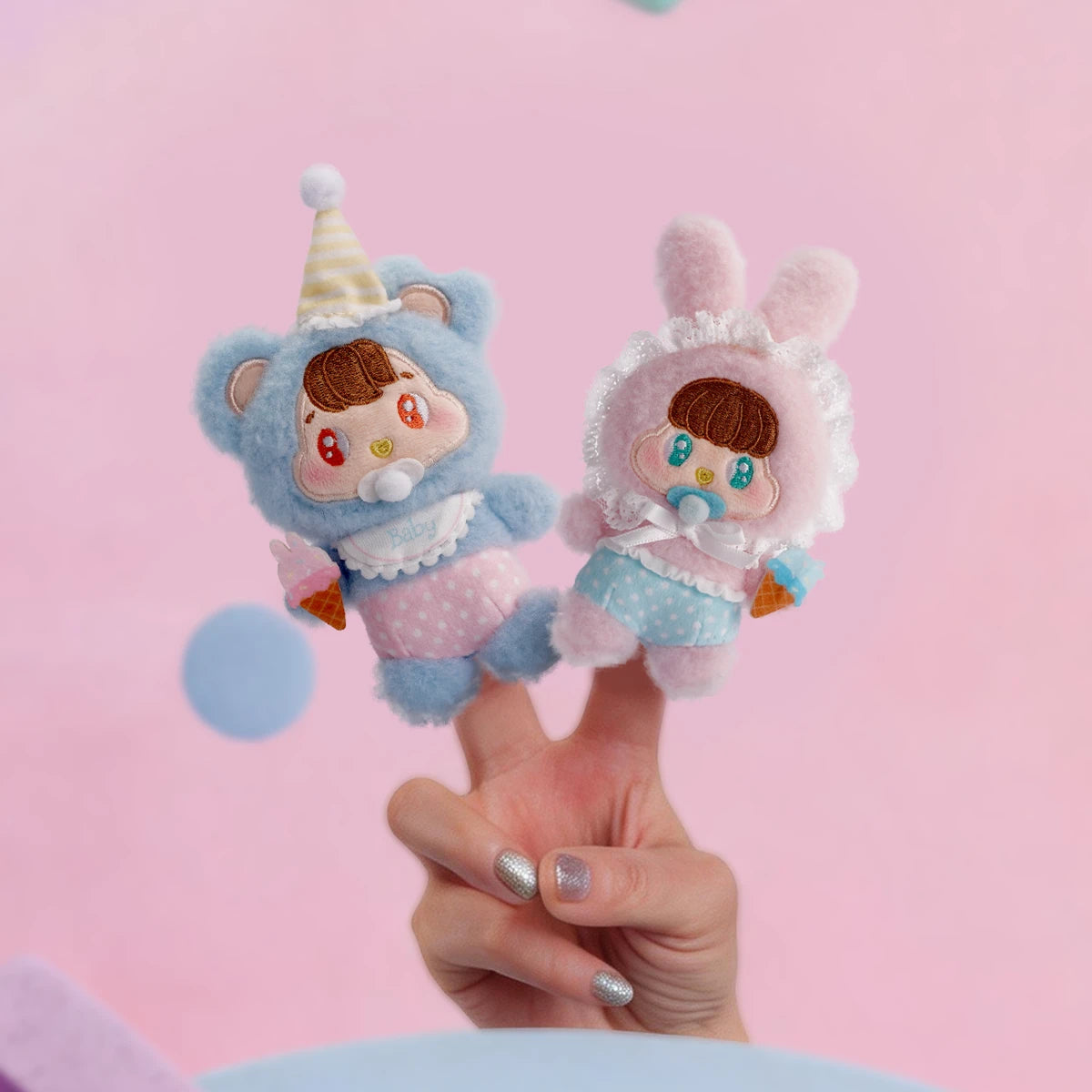 Baby Bear and Baby Bunny plush balanced on fingertips, Little Buns Children's Day keychain