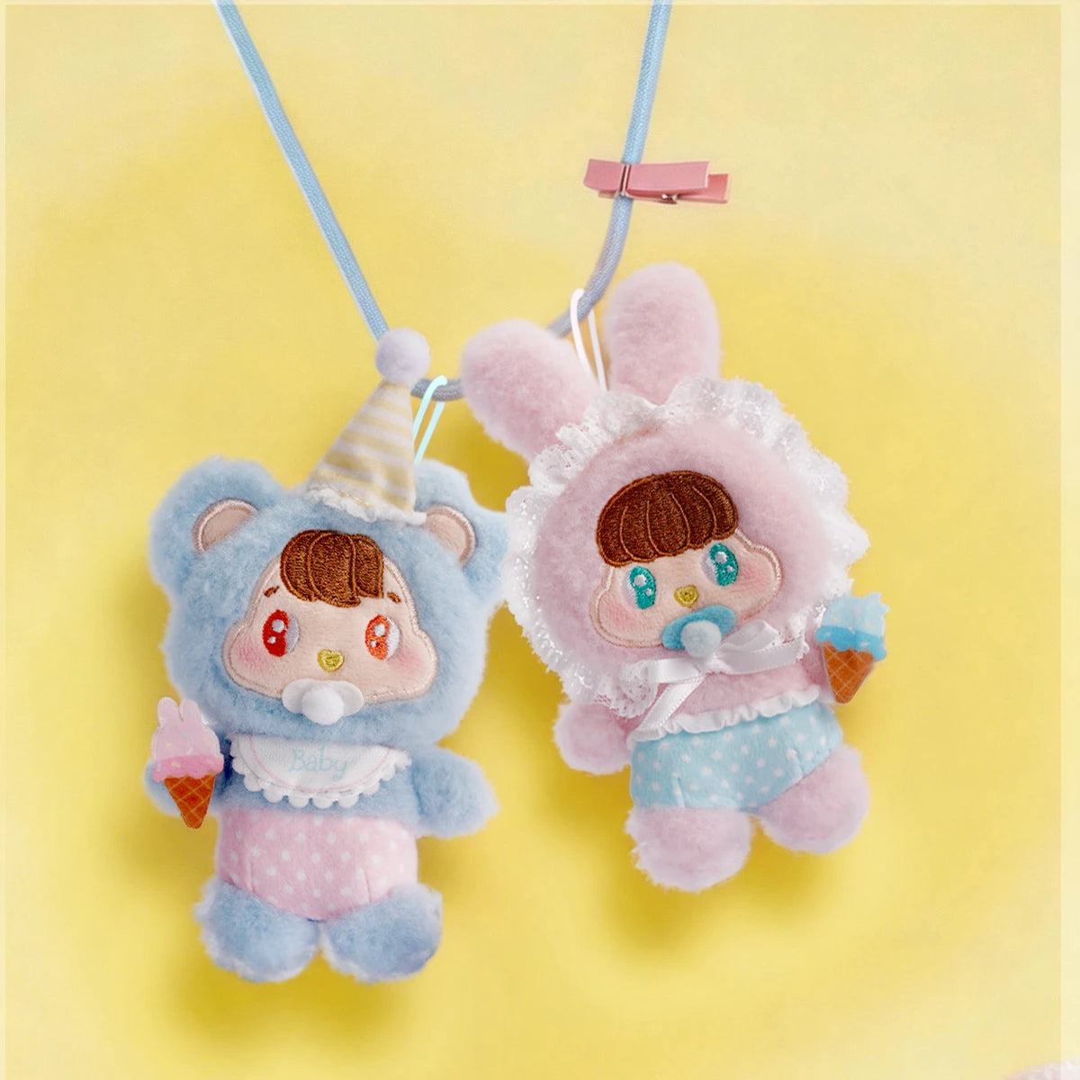 Baby Bear and Baby Bunny plush keychains hung by cords, Little Buns Children's Day set