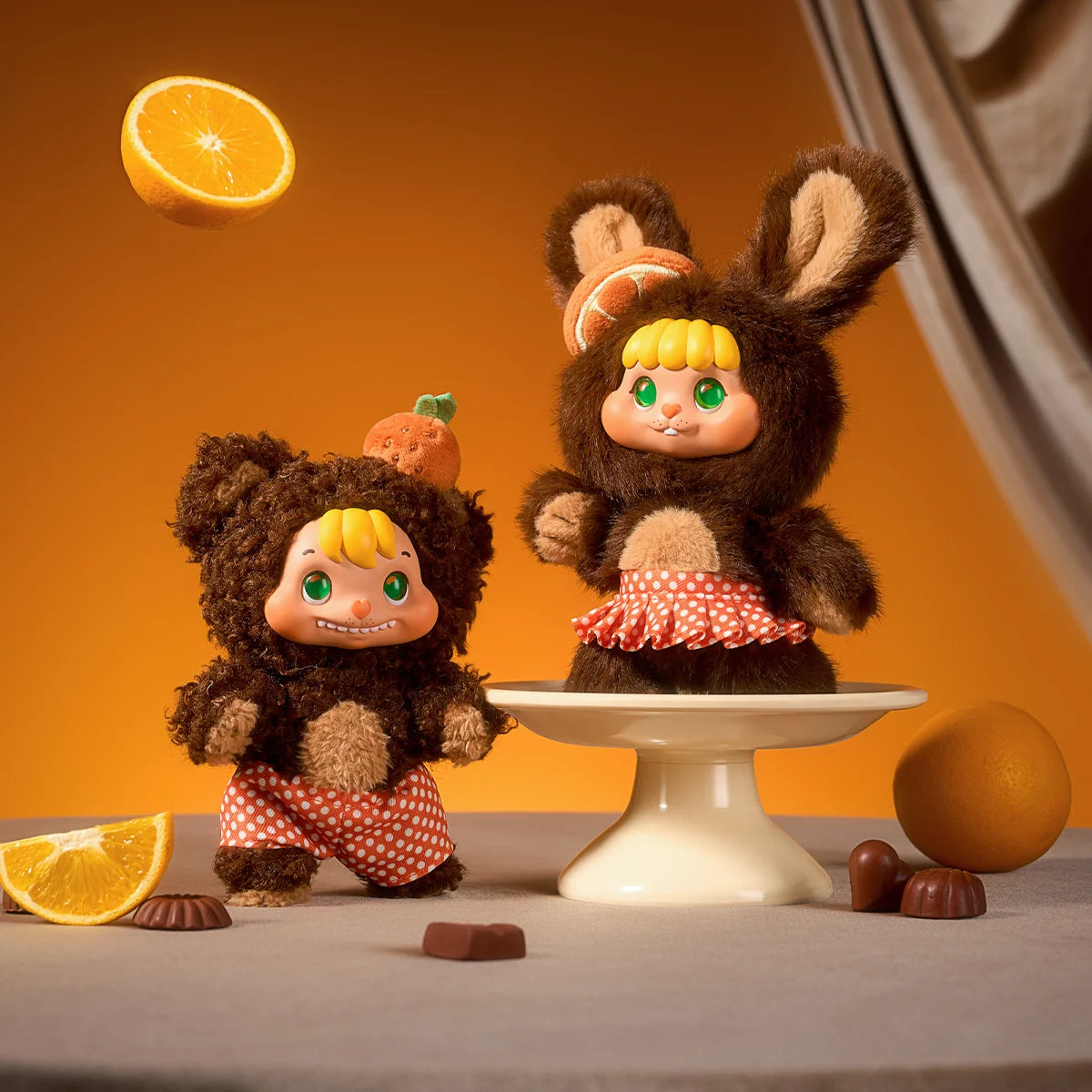 Orange Peel Chocolate brown pair with orange headpiece and polka-dot skirt, Little Buns Melting Together