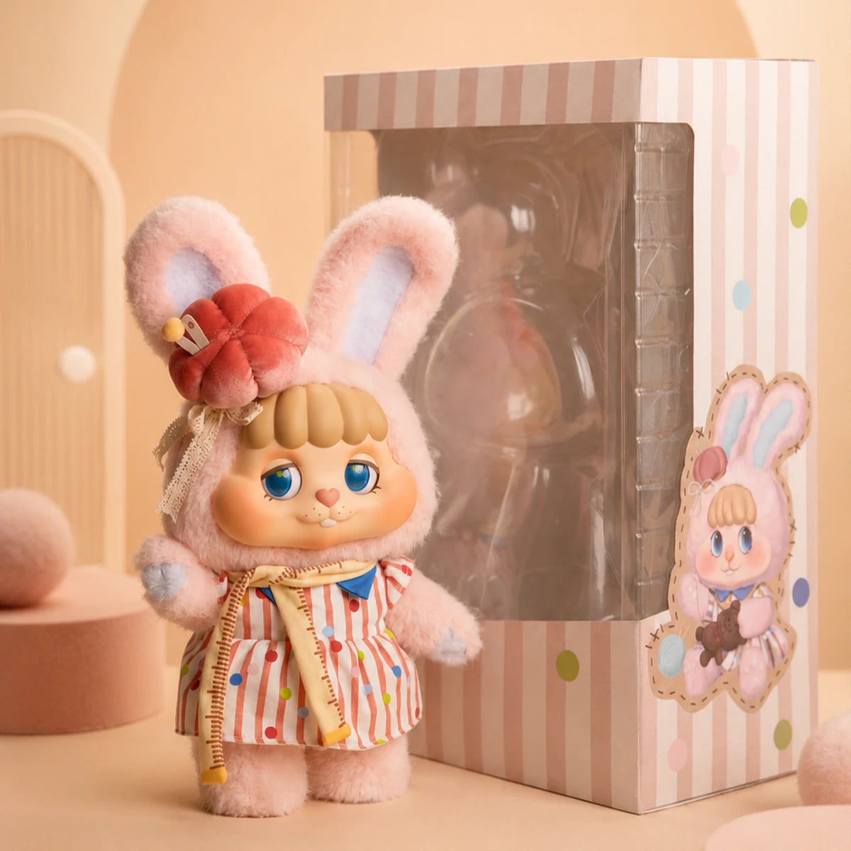 Tailor Bunny Bing plush figure beside its striped gift box packaging, Little Buns