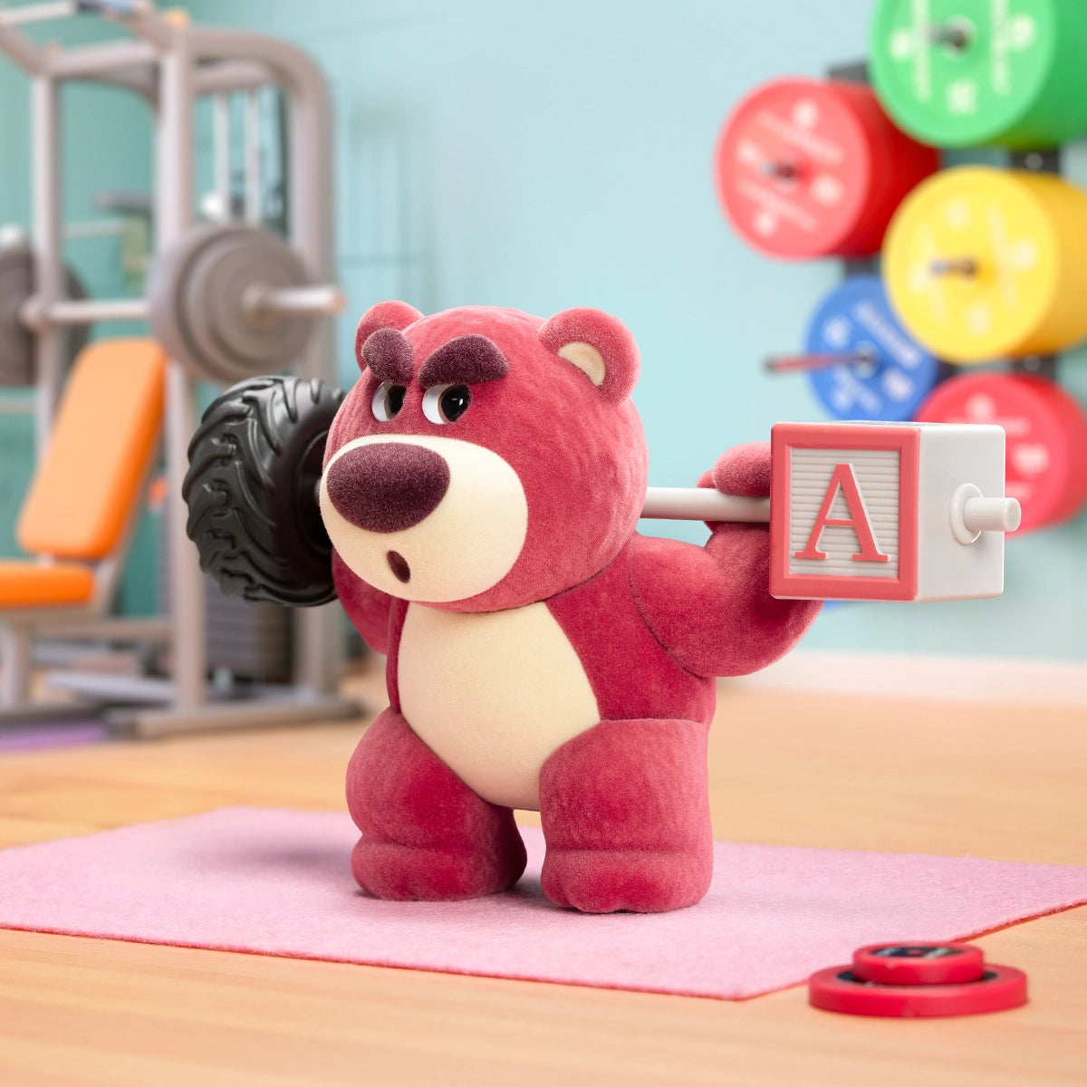 Lotso Fitness figure lifting a barbell made from a toy alphabet block and tire