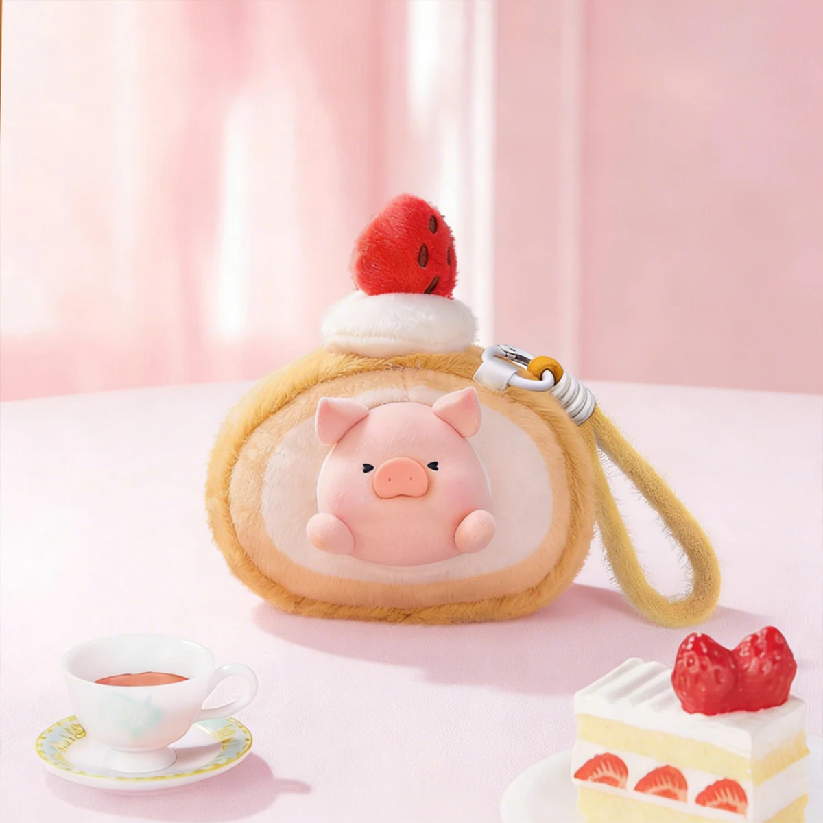 Strawberry Cake Roll pink LULU pig in a green leaf wrapper atop doughnuts, Diet Nemesis plush keychain