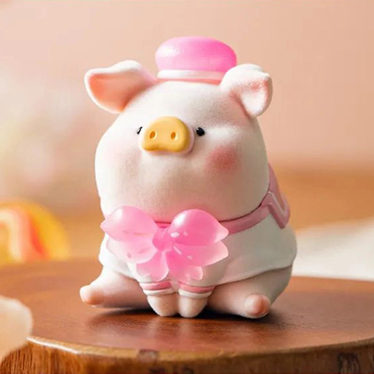 Lulu the Piggy holding a translucent pink cherry blossom in the In Bloom Sakura 2 series