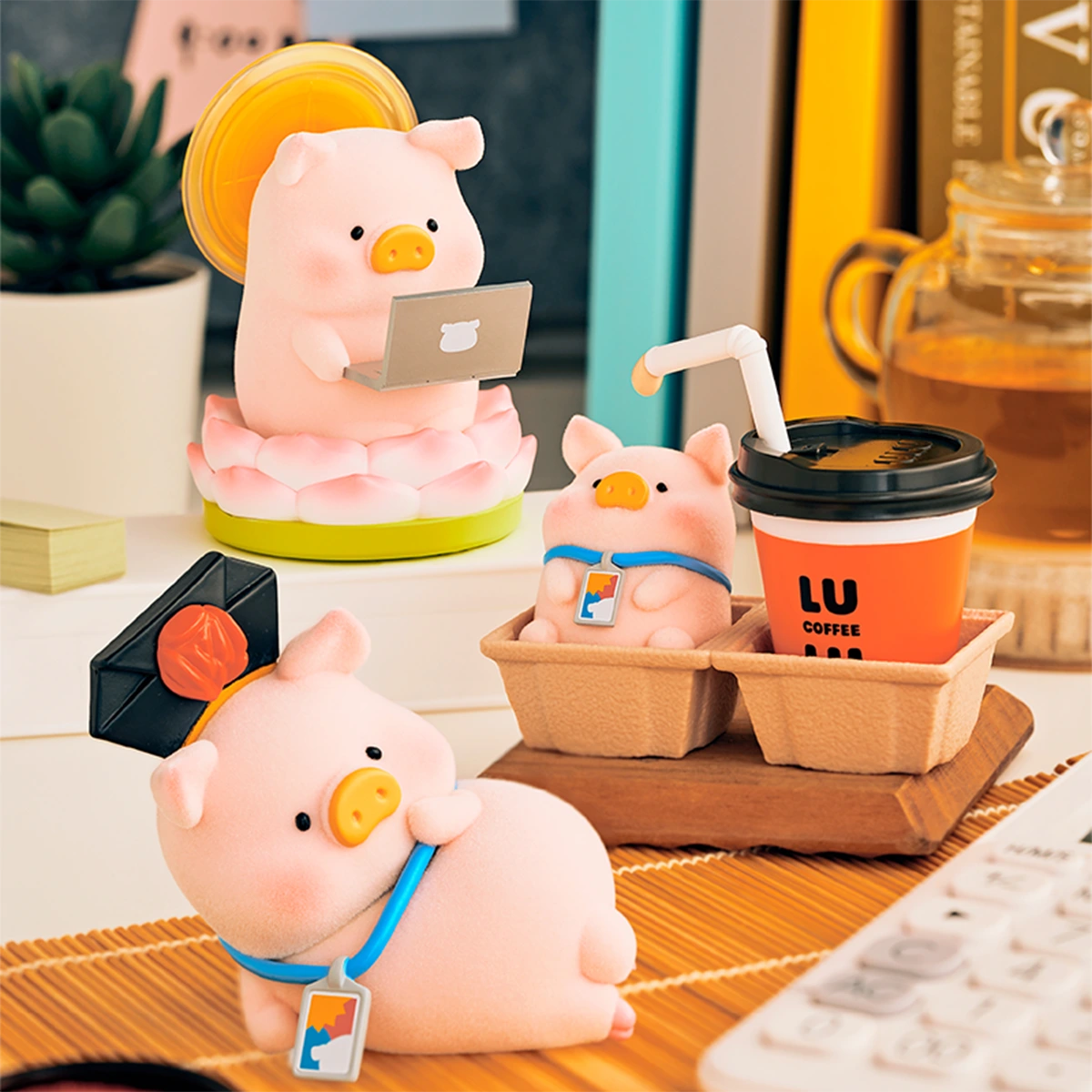 LuLu Piggy Office figures including Buddha Lu and Tea Break Lu by a coffee cup, blind box