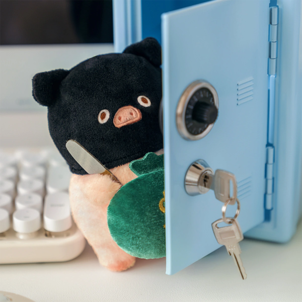 Salary Thief Lu black ninja piggy plush keychain with money bag beside a safe, LuLu Piggy Office