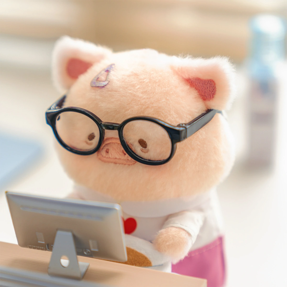 Coffee Break Lu piggy plush keychain wearing round black glasses at a monitor, LuLu Piggy Office
