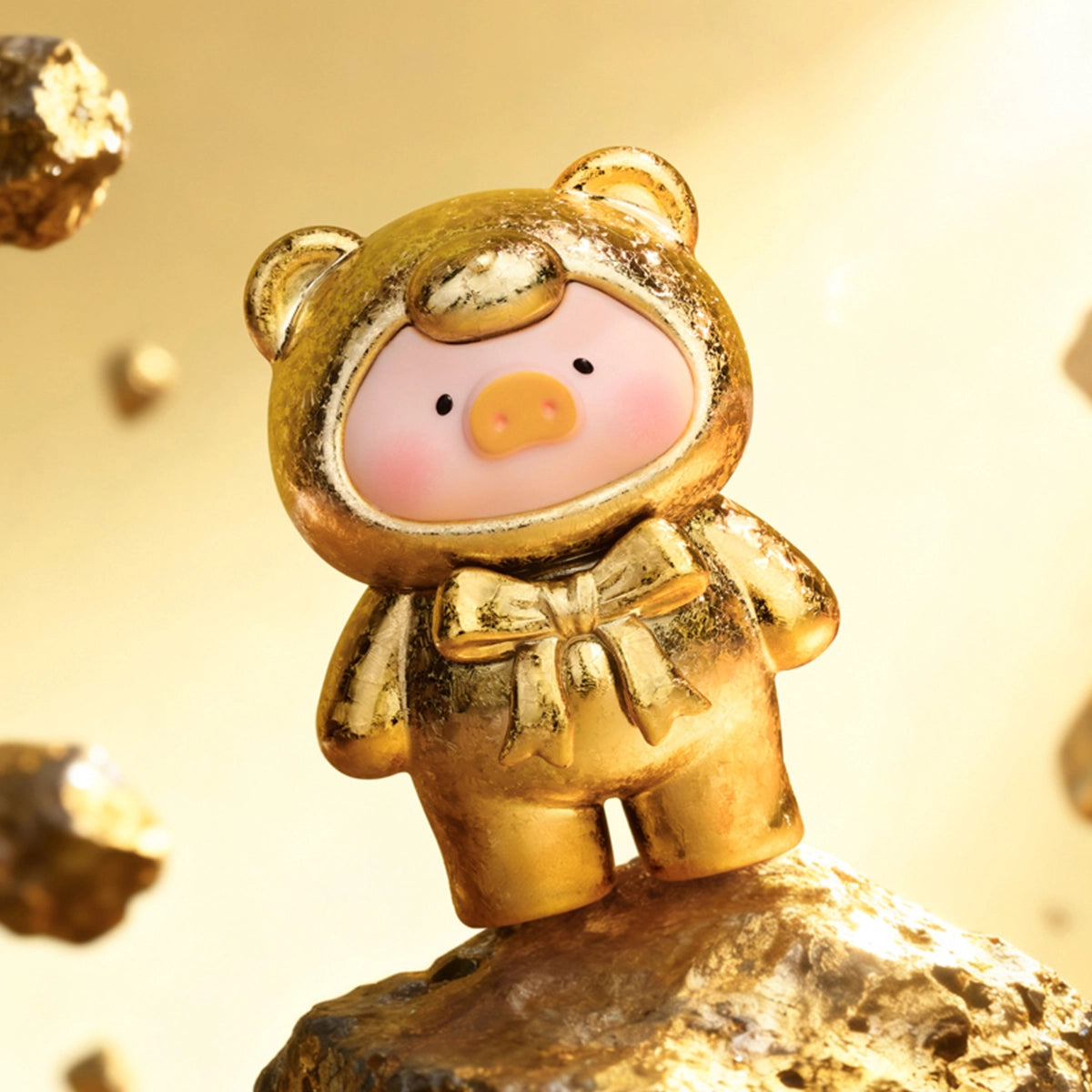 Golden Meteorite frosted gold metallic Lulu piggy figure on a gold rock, Teddy Mini Ore Collection
