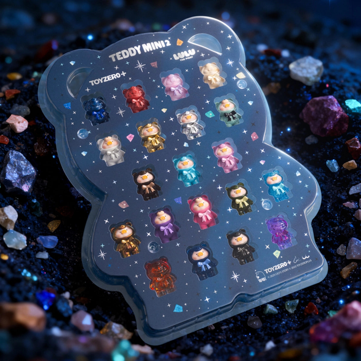 Teddy Mini display card of gemstone Lulu piggy figures on raw mineral gravel, Ore Collection